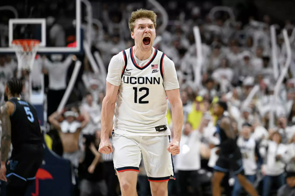 UConn guard Cam Spencer (12) reacts in the second half of an NCAA college basketball game against Villanova, Saturday, Feb. 24, 2024, in Storrs, Conn. (AP Photo/Jessica Hill)

